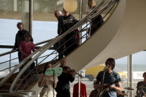 England, East Sussex, Bexhill on Sea, De La Warr Pavilion. Interior of the Art Deco Gallery and Arts Centre. Band performance under the stairwell from the Wilkomen Collective group including the Leisu...