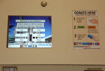 England, West Sussex, Chichester, Multi Lingual Donorpoint Machine for accepting credit or debit card donations.