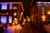 England, West Sussex, Southwick, Cul de Sac of house decorated with fairy lights for Christmas.