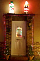 England, West Sussex, Southwick, Cul de Sac of house decorated with fairy lights for Christmas.