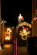 England, West Sussex, Southwick, Cul de Sac of house decorated with fairy lights for Christmas.