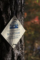 USA, New Hampshire, Marlborough, Audubon Wildlife Sanctuary sign Meetinghouse Pond Nature Reserve.