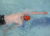 Sport, Watersport, Swimming, Manes Back Stroke, swimmer viewed from above mid stroke.