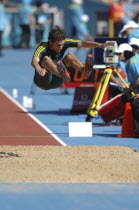 Sport, Athletics, Long Jump, Australia's Fabrice Lapierre in mid leap. 2006 Commonwealth Games in Melbourne Australia.
