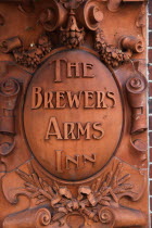 England, East Sussex, Lewes, High Street, Brewers Inn terracotta sign on pub wall.