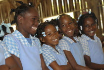 Caribbean, Haiti, Isla Laganave, Young School Girls in Blue uniforms.