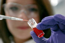 Science, Biology, Filling pipette with liquid from bottle. Scottish Life Science Awards 2009