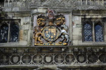 England, Wiltshire, Salisbury, Detail of weather worn North Gate in the High Street. Royal Coat of Arms with Diev et mon Droit written in latin, meaning God and my Right.