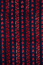 India, Rajasthan, Colourful red black blue and white patterned textile block print on cloth fabric.