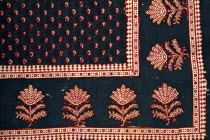 India, Rajasthan, Colourful red black blue and white patterned textile block print on cloth fabric.