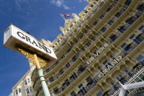 England, East Sussex, Brighton, The De Vere Grand Hotel entrance and facade of rooms with balconies and sign on the seafront with a Union Jack Flag flying from a flagpole on the roof