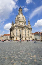 GERMANY, Saxony, Dresden, The restored Baroque church of Frauenkirch Church of Our Lady and surrounding restored buildings in Neumarkt square busy with sightseeing tourists.