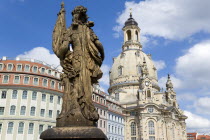 GERMANY, Saxony, Dresden, The restored Baroque church of Frauenkirch Church of Our Lady and surrounding restored buildings in Neumarkt square with a statue in the foreground.