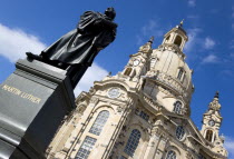 GERMANY, Saxony, Dresden, The restored Baroque church of Frauenkirch Church of Our Lady in Neumarkt square with a statue of Martin Luther in the foreground.