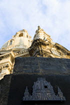 GERMANY, Saxony, Dresden, Detail in evening light of the Baroque Frauenkirche Church of Our Lady dome in Neumarkt square with the Karl Pinkert Stone in the foreground showing where it was the only rem...