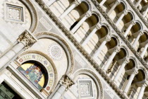 ITALY, Tuscany, Pisa, The Campo dei Miracoli or Field of Miracles with the Lombard style 12th Century facade of the Duomo Cathedral church.