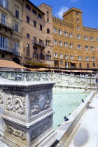 ITALY, Tuscany, Siena, The 19th Century replica of the 15th Century white marble Fonte Gaia fountain by the artist Jacopo della Quercia in the Piazza del Campo.