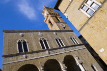 ITALY, Tuscany, Pienza, Val D'Orcia Piazza Pio II with Palazzo Communale Town Hall with its campanile belltower.