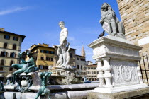 ITALY, Tuscany, Florence, The 1575 Mannerist Neptune fountain with the Roman sea God surrounded by water nymphs commemorating Tuscan naval victories by Ammannatti in the Piazza della Signoria beside t...