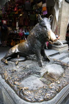 ITALY, Tuscany, Florence, The 17th century bronze fountain called Il Porcellino in the Mercato Nuovo also known as the Straw Market where the snout of the wild boar shines where people rub it under th...