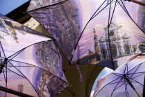 ITALY, Tuscany, Florence, Souvenir stall on the Ponte Vecchio Bridge selling umbrellas with scenes of the city on them.
