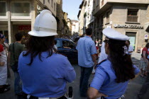 ITALY, Tuscany, Florence, Female police officers watching traffic and tourists in Via Por Santa Maria by the Ponte Vecchio Bridge.