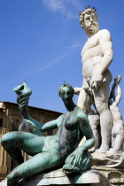 ITALY, Tuscany, Florence, The 1575 Mannerist Neptune fountain with the Roman sea God surrounded by water nymphs commemorating Tuscan naval victories by Ammannatti in the Piazza della Signoria beside t...