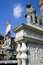 ITALY, Tuscany, Florence, The 1575 Mannerist Neptune fountain with the Roman sea God surrounded by water nymphs commemorating Tuscan naval victories by Ammannatti in the Piazza della Signoria beside t...
