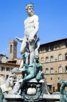 ITALY, Tuscany, Florence, The 1575 Mannerist Neptune fountain with the Roman sea God surrounded by water nymphs commemorating Tuscan naval victories by Ammannatti in the Piazza della Signoria beside t...