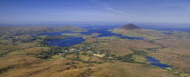 IRELAND, County Galway, Connemara, Diamond Hill,  Ballynakill Harbour as seen from the slopes of the hill  Hikers at viewpoint. 
