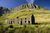 IRELAND, County Sligo, Gleniff, Gleniff Horseshoe, ruin which was formerly a school for miners children  Ben Bulben in background. 
