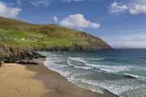 IREland, County Kerry, Dingle Peninsula, Coumeenole Beach at Slea Head  Figure on beach with incoming waves. 