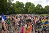 ENGLAND, London, Hyde APrk, Naked people riding their bicycles on formation at Hyde Park while participating at the world naked bike ride protest parade.