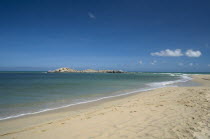 VENEZUELA, Margarita Island, Playa Caribe, View of exotic beach with its tropical crystal clear seawaters shoot on a bright day with blue sky and white clouds.