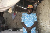 HAITI, Isla de la Laganave, Woman inside her shack.