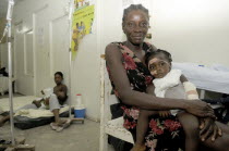 Haiti, Isla de Laganave, Mother and Daughter in makeshift hospital post eargthquake.