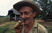 CUBA, Vinales, Portrait of tobacco planter smoking cigar. 