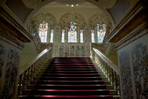 Ireland, North, Belfast, City Hall, Interior with stairs leading up past stained glass windows.