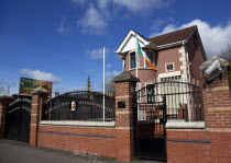 Ireland, North, Belfast, Andersonstown, James Connolly  House, Sinn Fein Headquarters with Irish Tricolour flag flying.