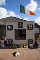 Ireland, North, Belfast, Andersonstown, South Link, IRA Belfast Brigade memorial with Easter flowers.