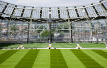 Ireland, County Dublin, Dublin City, Ballsbridge, Lansdowne Road, Aviva 50000 capacity all seater Football Stadium designed by Populus and Scott Tallon Walker. A concrete and steel structure with polycarbonate self cleaing glass exterior built at a cost of 41 million Euros. Home to the national Rugby and Soccer teams, aslo used as a concert venue showing the north end of the stadium features a smooth slope that dips to allow daylight to reach nearby residences. 