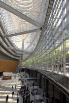 Japan, Tokyo, Yurakucho, the International Forum Building, the atrium lobby, all glass, outside courtyard and trees visible off upper level.