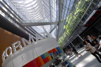 Japan, Tokyo, Yurakucho, inside the International Forum Building, the enormous atrium lobby, all glass, information booth.