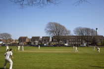 England, West Sussex, Southwick, Local Cricket team playing on village green.