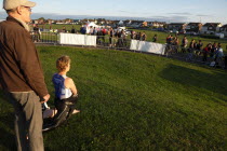 England, West Sussex, Goring-by-Sea, Worthing Triathlon 2009, Competitor warming up and stretching before swim.