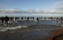 England, West Sussex, Goring-by-Sea, Worthing Triathlon 2009, male competitors at the swim start.