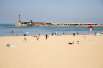 England, Kent, Margate beach with sunbathers.