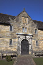 England, West Sussex, East Grinstead, Sackville College a former Alms house sandstone built with sundail over the entrance.