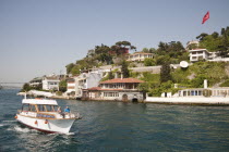 Turkey, Istanbul, People cruising on the Bosphorus Strait, on a small boat.