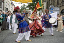 Wales, Denbighshire, Llangollen International Music Festival,Indian performers during parad through streets.